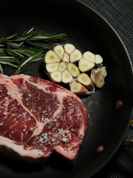 raw meat on black plate