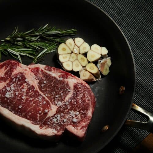 raw meat on black plate